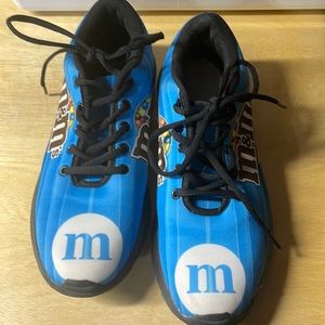 Ladies blue M&M tennis shoes.